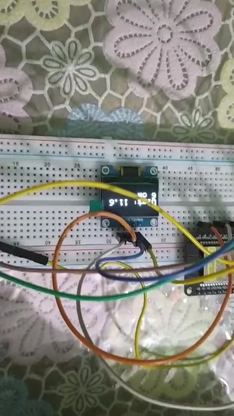 OLED display showing the measured distance