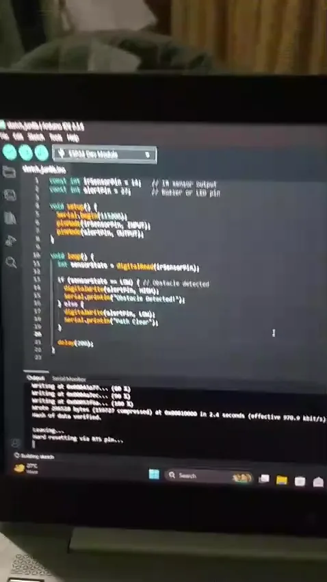 Arduino IDE showing obstacle detection code and serial output