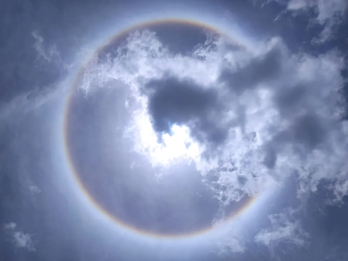 A circular halo around the sun through clouds