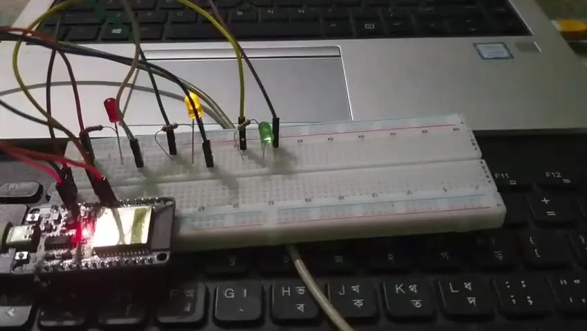 Traffic light model with yellow LED on